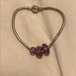 Three charms and bracelet
